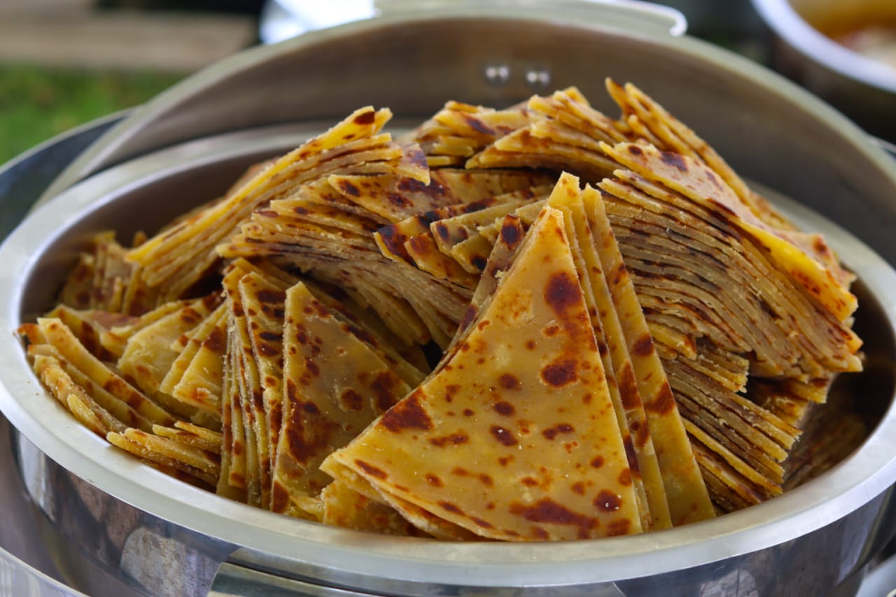 Fresh chapati cut into triangles for buffet service