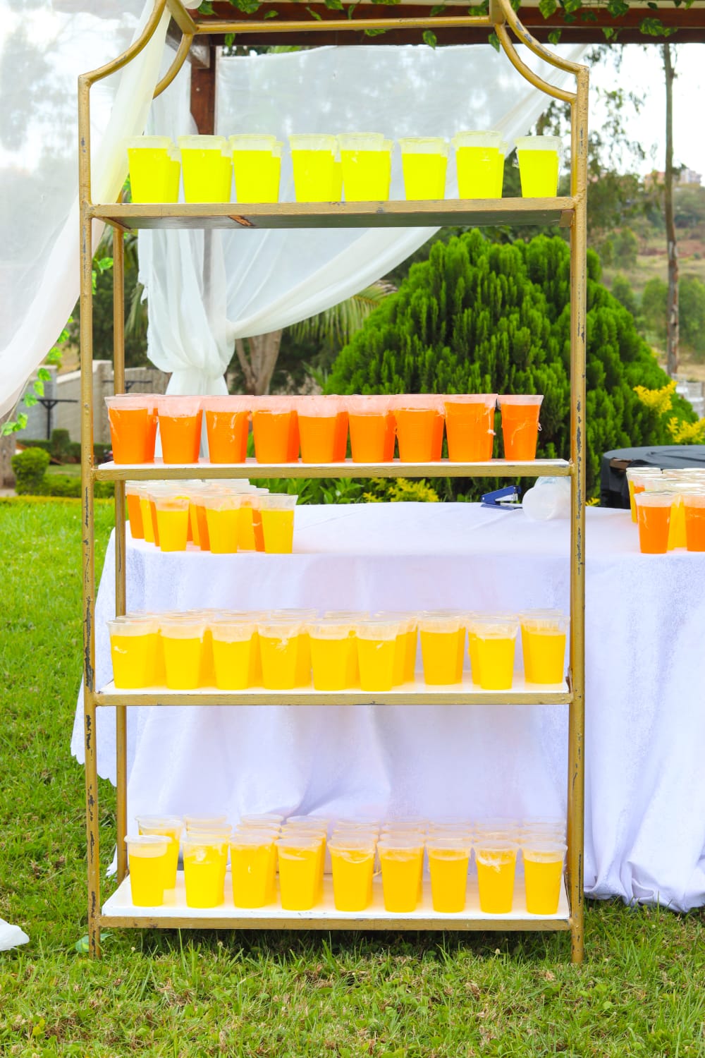 Colourful refreshments arranged on a gold display stand