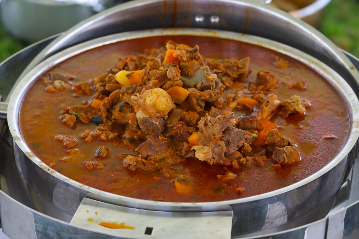 Meat stew with carrots in a buffet chafing dish