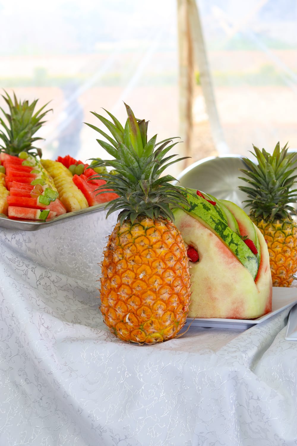 Pineapple and carved watermelon buffet centrepieces