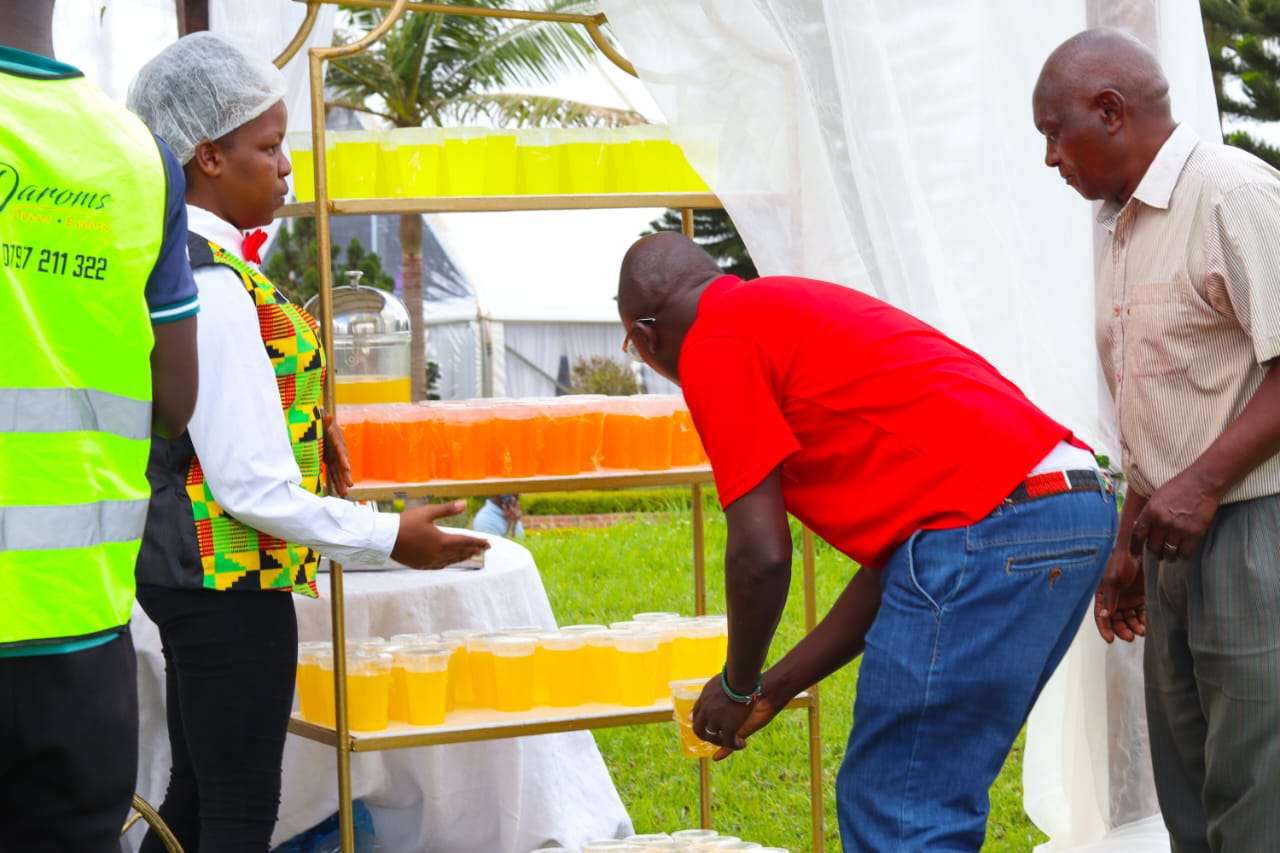 Hospitality staff assisting guests at the refreshment stand